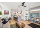 Open-concept living space with hardwood floors, modern decor, kitchen with island and dining area at 1299 Newton St, Denver, CO 80204