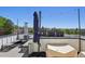 Rooftop deck with seating, umbrella, and city view at 1299 Newton St, Denver, CO 80204