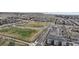 Aerial view of homes next to community park, baseball field, soccer field and walking paths at 10204 Ridgegate Cir, Lone Tree, CO 80124