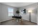Bedroom furnished with a modern desk, stylish floor lamp and artistic wall decor at 10204 Ridgegate Cir, Lone Tree, CO 80124