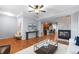 Cozy living space showcasing hardwood floors and an open-concept layout at 10204 Ridgegate Cir, Lone Tree, CO 80124