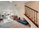 Finished basement with plush seating area, stairs, and walk-out access at 2039 S Corona St, Denver, CO 80210