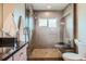 Modern bathroom with tiled shower and sleek toilet and vanity at 2039 S Corona St, Denver, CO 80210