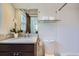 Neutral bathroom with granite vanity, and glass shelving at 2039 S Corona St, Denver, CO 80210
