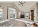 Spacious bedroom with fireplace, balcony, and comfortable seating area at 2039 S Corona St, Denver, CO 80210