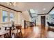 Inviting dining room area with hardwood floors, modern lighting, and staircase access at 2039 S Corona St, Denver, CO 80210