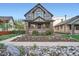 Charming brick home with beautifully landscaped front yard and inviting curb appeal at 2039 S Corona St, Denver, CO 80210