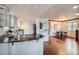 Open-concept kitchen with sleek countertops, modern appliances, and view of dining area at 2039 S Corona St, Denver, CO 80210