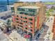 Aerial view of mixed-use buildings with restaurants and outdoor seating at 2100 16Th St # 204, Denver, CO 80202