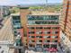 Aerial view featuring a mixed-use building, with restaurants and outdoor seating at 2100 16Th St # 204, Denver, CO 80202