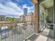 Balcony of brick building with view of other brick buildings and blue sky at 2100 16Th St # 204, Denver, CO 80202
