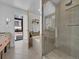 Modern bathroom featuring a glass-enclosed shower and a soaking tub at 2100 16Th St # 204, Denver, CO 80202