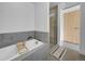 Serene bathroom featuring a soaking tub, glass shower, and contemporary design at 2100 16Th St # 204, Denver, CO 80202