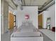Bright bedroom featuring industrial ductwork, minimalist design and large windows at 2100 16Th St # 204, Denver, CO 80202