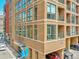 A contemporary brick apartment building featuring balconies and large windows providing natural light at 2100 16Th St # 204, Denver, CO 80202