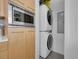 Updated kitchen with stainless steel microwave and convenient stackable washer and dryer at 2100 16Th St # 204, Denver, CO 80202