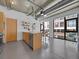 Bright kitchen with an open floor plan and stainless steel appliances, opening into the dining area at 2100 16Th St # 204, Denver, CO 80202
