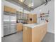 Modern kitchen with stainless steel appliances, an island with quartz countertop at 2100 16Th St # 204, Denver, CO 80202