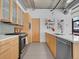 Bright kitchen features stainless steel appliances and quartz countertops at 2100 16Th St # 204, Denver, CO 80202