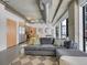 Living room and kitchen area features exposed ductwork, concrete ceiling and an open floor plan at 2100 16Th St # 204, Denver, CO 80202