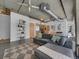 Living room and kitchen area features exposed ductwork, concrete ceiling and an open floor plan at 2100 16Th St # 204, Denver, CO 80202