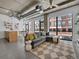 Bright living room features an open floor plan and expansive windows offering lots of natural light at 2100 16Th St # 204, Denver, CO 80202