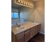 Bathroom with double sinks, a large mirror, and a bathtub at 560 Hampstead Ave, Castle Rock, CO 80104