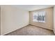 Bedroom featuring carpet flooring, neutral walls, and window for natural light at 560 Hampstead Ave, Castle Rock, CO 80104