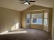 Primary bedroom with bay window and carpet at 560 Hampstead Ave, Castle Rock, CO 80104