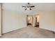 Neutral-toned bedroom with carpet floors and direct access to other rooms at 560 Hampstead Ave, Castle Rock, CO 80104