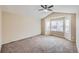 Bedroom featuring carpet floors, neutral walls, and large windows for great natural light at 560 Hampstead Ave, Castle Rock, CO 80104