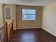 Upstairs bedroom with dark wood floors and a window at 560 Hampstead Ave, Castle Rock, CO 80104