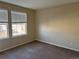 Bright bedroom with neutral walls and carpet, featuring two large windows at 560 Hampstead Ave, Castle Rock, CO 80104