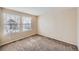 Bedroom featuring carpet flooring, neutral walls, and window for natural light at 560 Hampstead Ave, Castle Rock, CO 80104