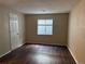 Simple bedroom with dark wood floors and a window at 560 Hampstead Ave, Castle Rock, CO 80104