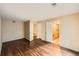 Bedroom with wood-look floors, featuring multiple closets and doors, allowing for ample storage at 560 Hampstead Ave, Castle Rock, CO 80104