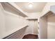 Walk-in closet with wood floors, shelving, and plenty of storage space at 560 Hampstead Ave, Castle Rock, CO 80104