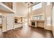 Bright and airy living room with fireplace, hardwood floors, and an open layout at 560 Hampstead Ave, Castle Rock, CO 80104