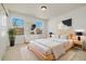 A cozy bedroom with a bright window view, natural light, and neutral tones promotes relaxation at 6232 W Cross Dr, Littleton, CO 80123