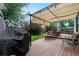 Well-appointed back deck featuring a grill, dining set, and seating area at 4707 N Bearlily Way, Castle Rock, CO 80109