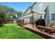 Spacious backyard featuring a large wooden deck and green lawn at 4707 N Bearlily Way, Castle Rock, CO 80109