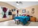 Inviting bedroom with natural light, light carpet, vaulted ceiling, and decorative wall art at 4707 N Bearlily Way, Castle Rock, CO 80109