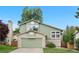 Charming home with a well-manicured lawn and attached two-car garage at 4707 N Bearlily Way, Castle Rock, CO 80109