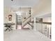 Second-floor hallway area with high ceilings and staircase at 4707 N Bearlily Way, Castle Rock, CO 80109