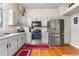 Modern kitchen with stainless steel appliances, granite countertops, and white cabinetry at 4707 N Bearlily Way, Castle Rock, CO 80109