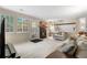 Open concept living room featuring a fireplace and access to the outdoor patio at 4707 N Bearlily Way, Castle Rock, CO 80109