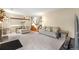 Bright living room featuring neutral-toned furnishings and staircase view at 4707 N Bearlily Way, Castle Rock, CO 80109