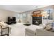 View of fireplace with a mantel, lots of natural light, and neutral-colored furnishings at 4707 N Bearlily Way, Castle Rock, CO 80109