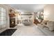 Cozy living room with fireplace and access to an outdoor patio at 4707 N Bearlily Way, Castle Rock, CO 80109