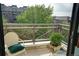 Private balcony with scenic views of the surrounding greenery and neighborhood at 180 Cook St # 406, Denver, CO 80206
